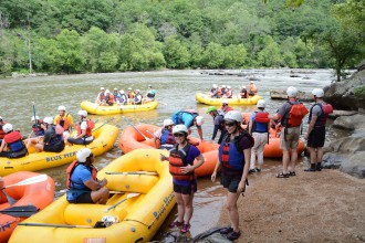 NEXT BIG THING: The revitalization of the French Broad River has made it a focal point of Buncombe and Madison counties’ economies, bringing thousands of locals and tourists alike to the water’s edge and supporting a bevy of new restaurants, bars and outdoor companies. Photo by Blue Heron Whitewater; courtesy of RiverLink
