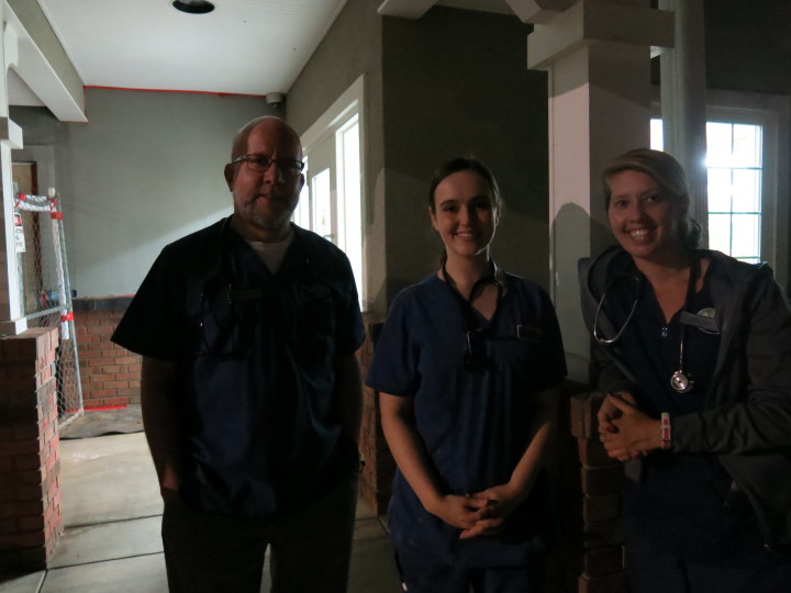 EMERGENCIES KNOW NO HOUR: Dr. Jeff Johansson and colleagues Becca Whisnant and April Kormanec outside REACH. The animal 24 hour hospital handles emergency calls for most of WNC, as well as North Georgia and Eastern Tennessee. Photo by Thomas Calder  
