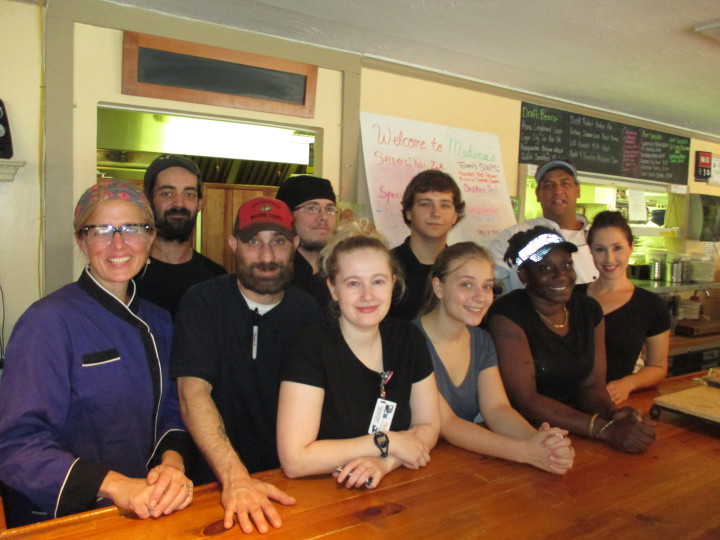 THE WHOLE GANG: John and Megan Medina, far right and far left, respectively, are pictured with their staff at Chimney Rock's Medina's Village Bistro. Photo by Liisa Andreassen