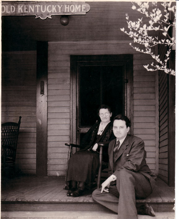 YOU CAN GO HOME AGAIN: It wouldn't be until 1937 that Wolfe returned to Asheville. He sits with his mother, Julia, on the front porch of the Old Kentucky Home. Photo courtesy of North Carolina Collection, Pack Memorial Public Library, Asheville, North Carolina