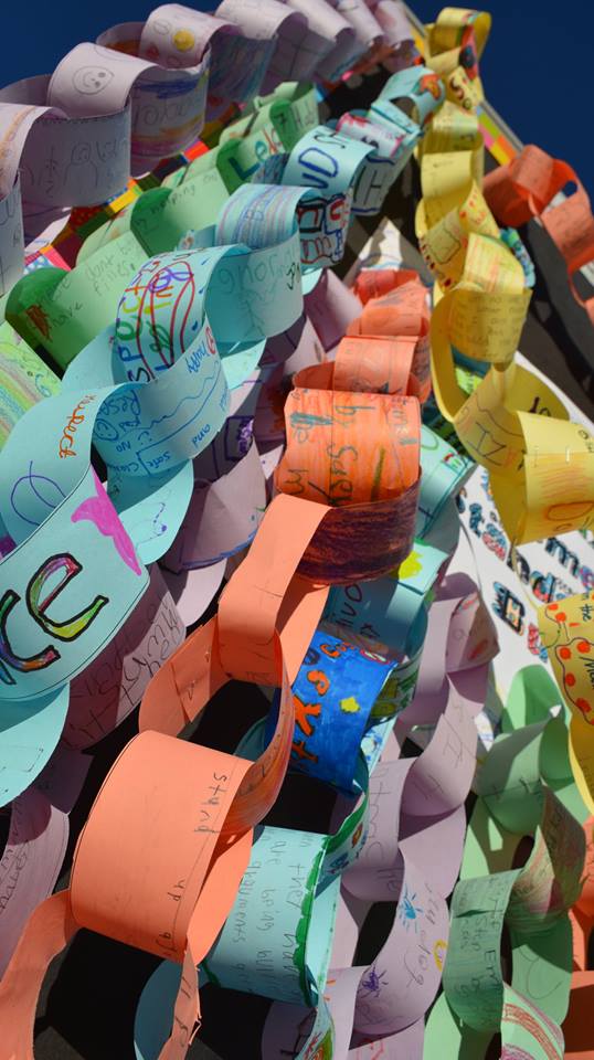 ROPED IN: Students made a rope of pledges to not bully this school year at the Anti Bullying rally. Photo courtesy of Asheville City Schools