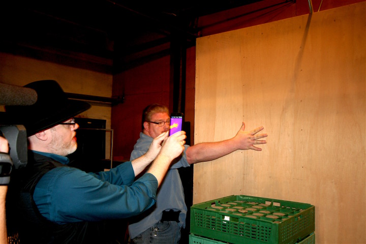 HOT SPOTS: Warren demonstrates the capabilities of thermal imaging cameras with Marion paranomal investigator Daniel Hurst. Photo by Max Hunt
