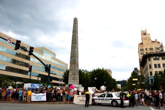 RISE OF REBELLION: A protest at the Vance Monument drew hundreds in the wake of white nationalist violence in Charlottesville in August. Photo by Carolyn Morrisroe