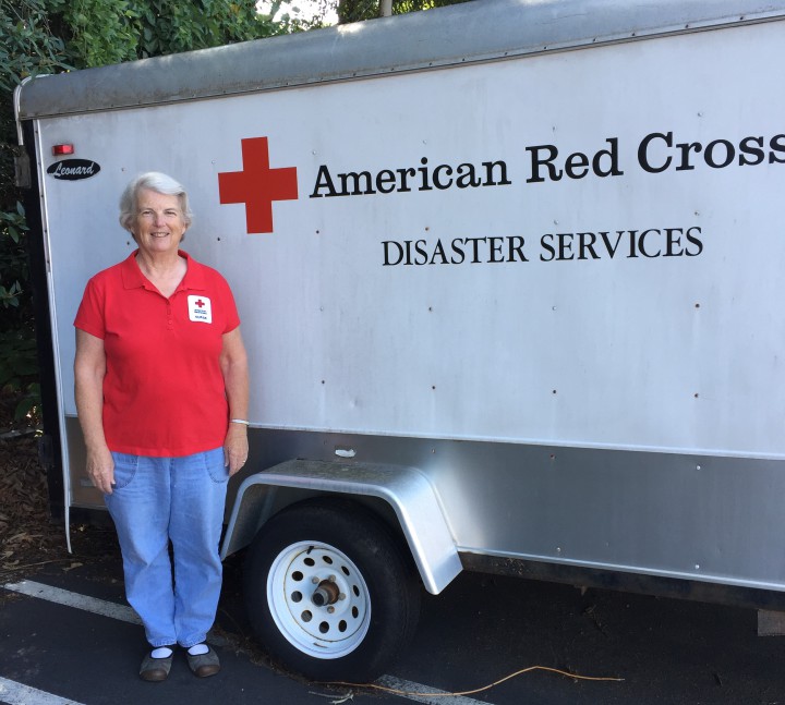 Fran Schlesinger stands by one of the Red Cross emergency response vehicles, ready for deployment when disaster strikes. Photo courtesy of the American Red Cross Asheville Mountain Area Chapter