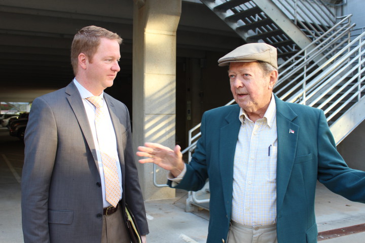 James Beck of Erwin Hills, right, spoke with Rich Lee about the I-26 connector after the event outside UNC Asheville's Sherrill Center. Photo by Virginia Daffron