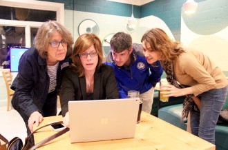 CALL ME MAYOR: Esther Manheimer watches precinct results come in at a family-friendly gathering at Well Played on Wall Street. Manheimer took 80.1 percent of the vote to win re-election. Photo by Virginia  Daffron