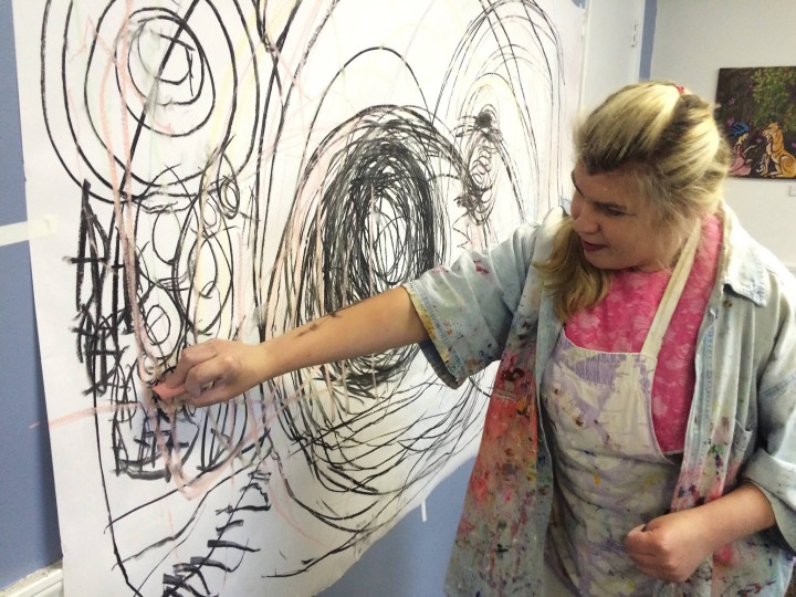 CREATIVE TOOLBOX: Artist Erin participates in a kinesthetic drawing class at Open Hearts Art Center, a local organization that provides day programs for adults with intellectual disabilities. “Some come to the program with not much experience,” says Salley Williamson. “They discover what they love through all the different activities that are offered here.” Photo by Brit Davis