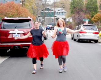 TOO, TOO PARTISAN: More than 350 people registered for the 5K, many showing up in festive attire. The League of Women Voters hosted the 5K to draw attention to the meandering line between the 10th and 11th congressional districts in Asheville. Photo by Sammy Feldblum
