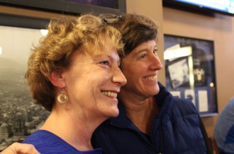SMILING FACES: Gwen Wisler, left, the only incumbent City Council member left in the race, smiles with Council member Julie Mayfield as results come in. Photo by Virginia Daffrom