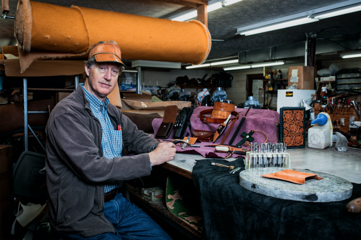 LEATHER MAN: In addition to western wear, Jackson's Western Store offers leather repair. John Jackson has been in the family business since the early '80s. Photo by Evan Anderson