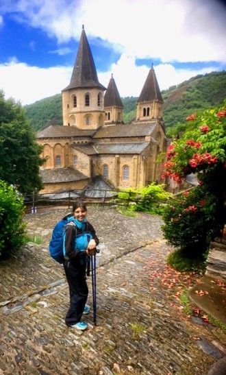 IN SEARCH OF ACCEPTANCE: Asheville teacher Rebecca Gallo, seen here on the Camino in Conques, France, walked the path in order to examine her own faith. Photo courtesy of Gallo