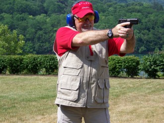 GUNS BLAZING: Firearms instructor Dan Meadows takes aim. Meadows has had to bump up the number of concealed carry classes he offers due to demand. Photo courtesy of Meadows