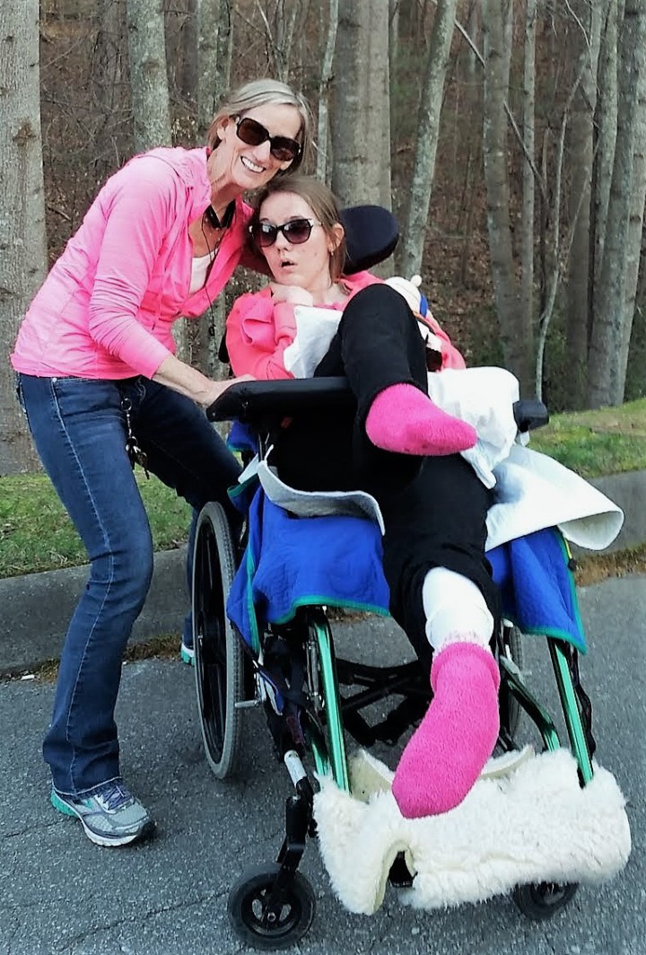 MAKING ACCOMMODATIONS: Robin Ambler and her daughter, Victoria. take their daily stroll outside the nursing home before Victoria came home. Photo courtesy of Robin Embler