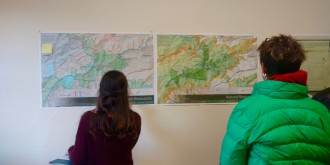 MAPPING OUT A PLAN: Attendees of a workshop peruse maps of the Waterrock Knob area in order to help prioritize its land uses. Photo by Daniel Walton
