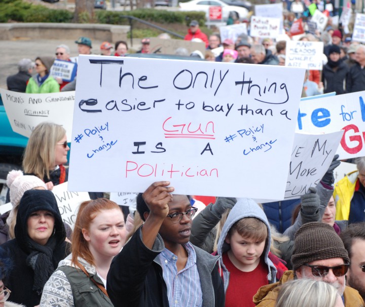 AB Tech student John Moore holds a sign at the Hendersonville March for Our Lives on March 24. Photo by Sammy Feldblum