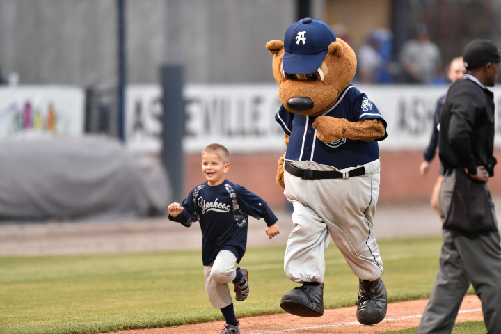 SPORTING GOOD TIME: Mascot Ted E. Tourist and the Asheville Tourists have been fixtures in the city's minor-league sports scene for some time. Photo by Tony Farlow/Four Seam Images