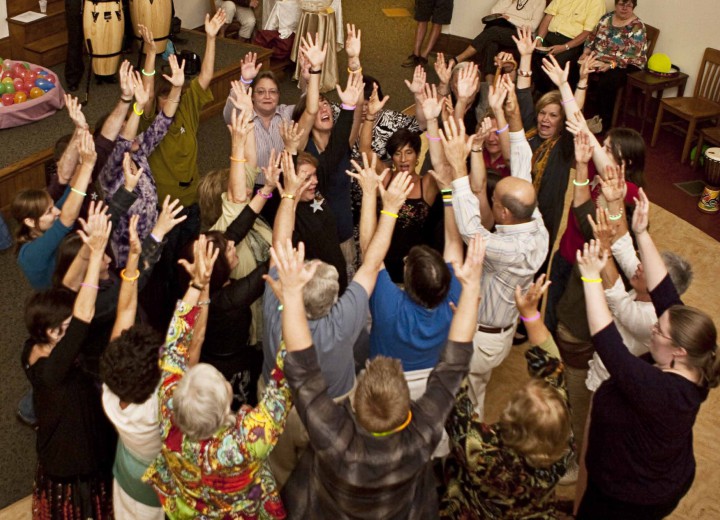 HANDS UP: Participants capture the energy of a Cosmic Mass at a creation spirituality gathering in 2010. Photo courtesy of Creation Spirituality Communities