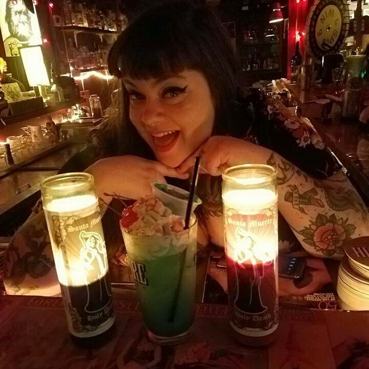 ODD SIPS: Odditorium bartender Jenny Lou is pictured with one of her crafty mocktail creations. The all-ages venue offers daily alcohol-free mixed-drink specials and has an inventive bar staff who enjoy devising custom concoctions to suit customers' tastes.