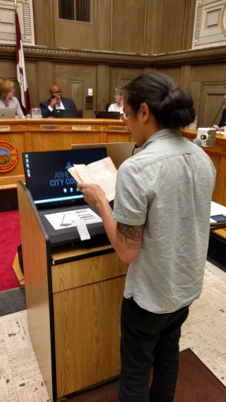 Filmmaker and Asheville FM DJ Andrew Vasco reads a passage from “A Man Without a Country” by Kurt Vonnegut as part of a public filibuster to encourage Council to take a stronger stance on Code for Asheville's open data petition. 