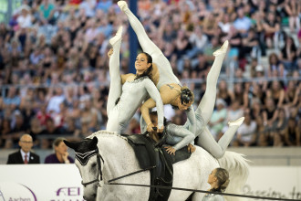 The sport of vaulting combines gymnastic movements with riding.  Photo courtesy of Tryon International Equestrian Center