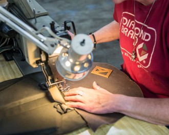 Diamond Brand Gear employee working on bag
