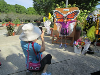 Girl posing as butterfly at the North Carolina Arboretum