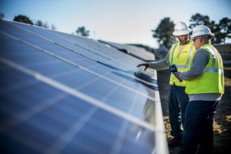 Duke energy solar technicians install panels