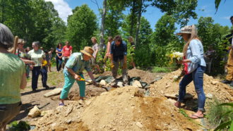 Burial site with people at Carolina Memorial Sanctuary