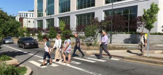 Pedestrians crossing College Street