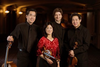 Ying Quartet, l-r: David Ying (cello), Janet Ying (violin), new first violinist Robin Scott, and Phillip Ying (viola) outside Kodak Hall at Eastman Theatre, Eastman School of Music March 23, 2015  // photo by J. Adam Fenster / University of Rochester