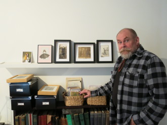 MIXING IT UP: Terry Taylor stands before some of his latest collages, which will be featured in his upcoming show, 'Re:Views.'