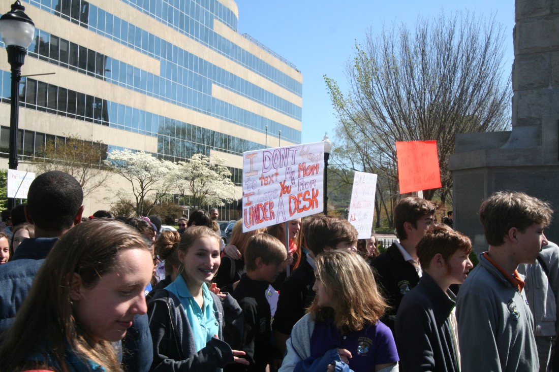 Student protestors with signs