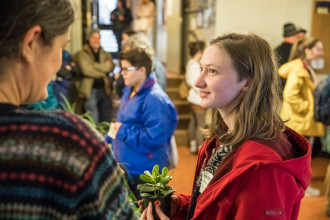 Accepted students and their families speak with students and faculty at the Biology and Environmental Studies plant sale during Accepted Students Day at Warren Wilson College in Asheville, NC on March 24, 2018. Photo: Reggie Tidwell