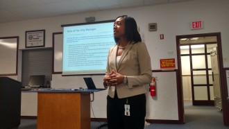 Jaime Joyner, assistant director of the city’s Human Resources Department, explains the role of the city manager in a public input meeting at the Skyland Fire Department in South Asheville.