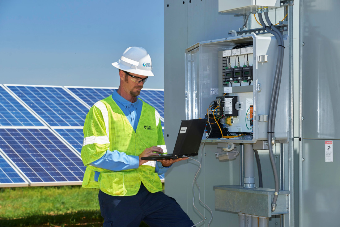 Duke Energy employee at solar panel