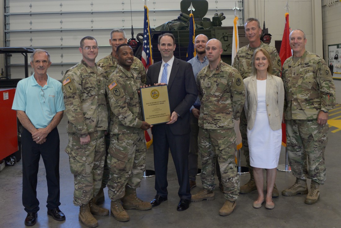 North Carolina National Guard members receive the Secretary of the Army Environmental Award from Jordan Gillis