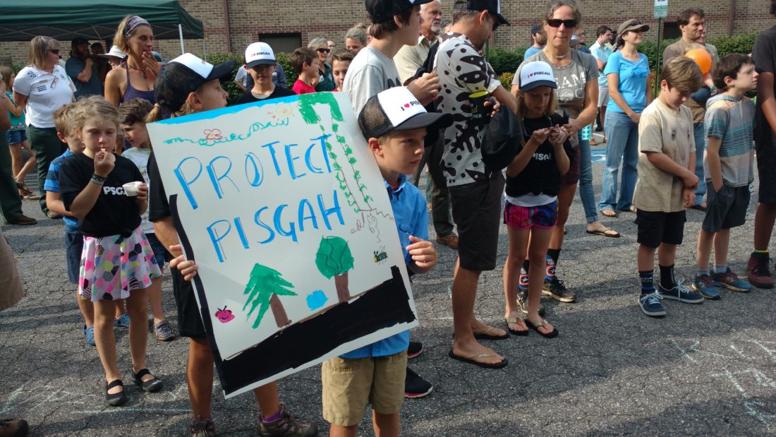 Kid with "Protect Pisgah" sign