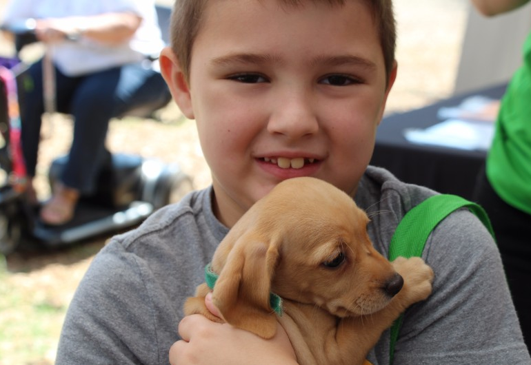 Young boy with puppy