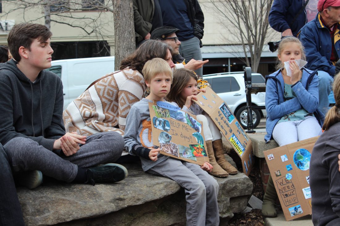 Protest signs at the Asheville Youth Climate Strike