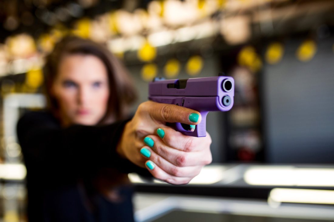 Woman with purple pistol