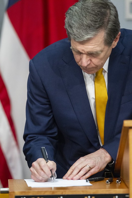 Roy Cooper signing COVID-19 relief bills