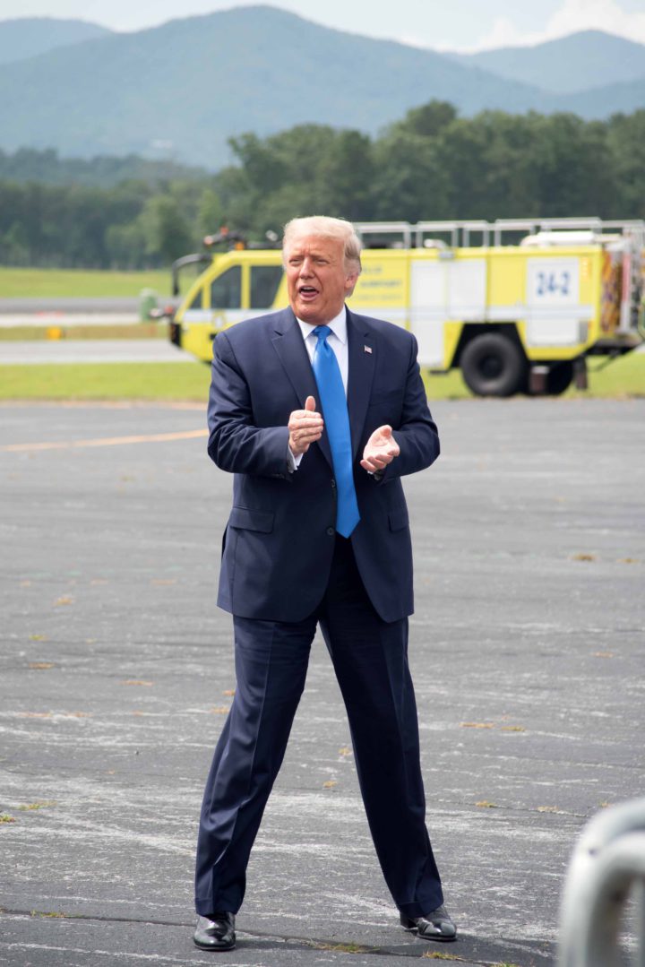 Trump applauding at Asheville Regional Airport
