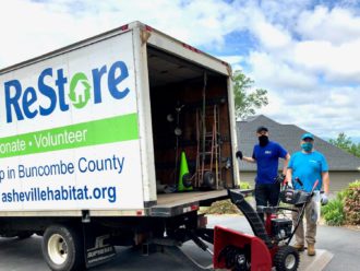 Habitat for Humanity volunteers with donations truck