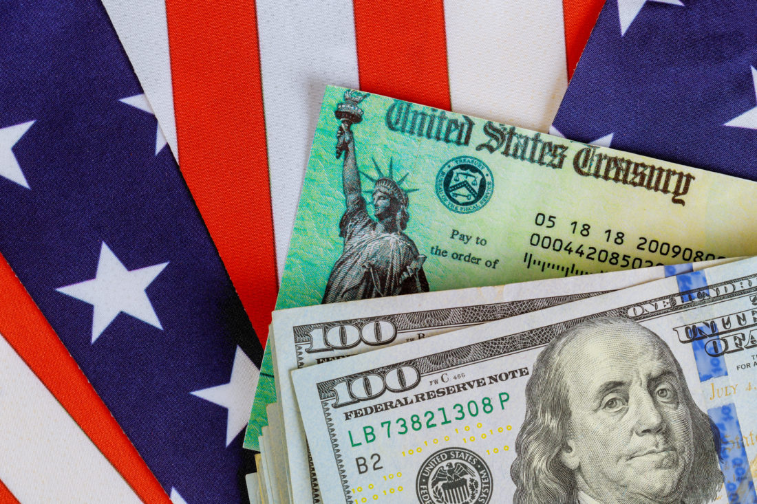 U.S. Treasury check with $100 bills