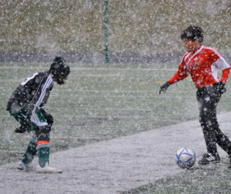Asheville Buncombe Youth Soccer Association players in the snow at John B. Lewis soccer complex